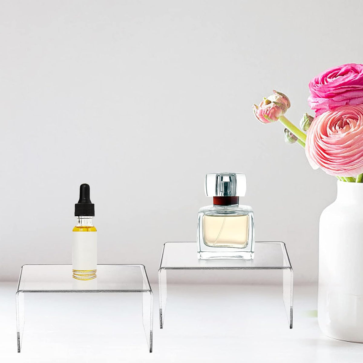 Grapas minis transparentes para exhibir perfumes